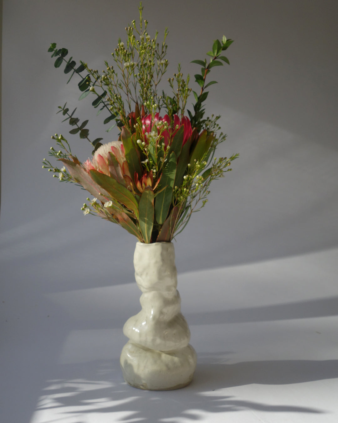 cream vase for flowers that is slouchy